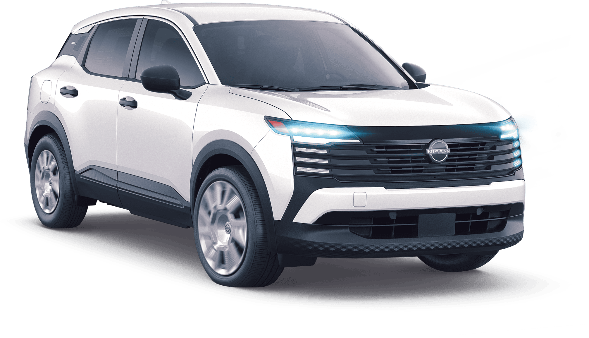 2025 Nissan Kicks in white with headlights on